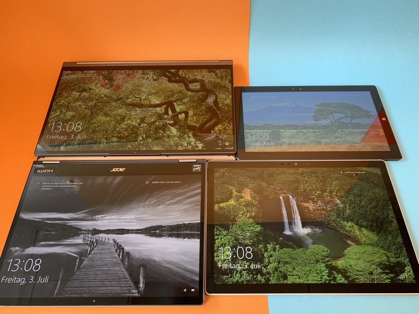 Unsere Testgeräte auf einen Blick. Von links oben: Lenovo Yoga C940-15IRH, Trekstor Surftab S11b, Acer Spin 5 und Microsoft Surface Book 3.